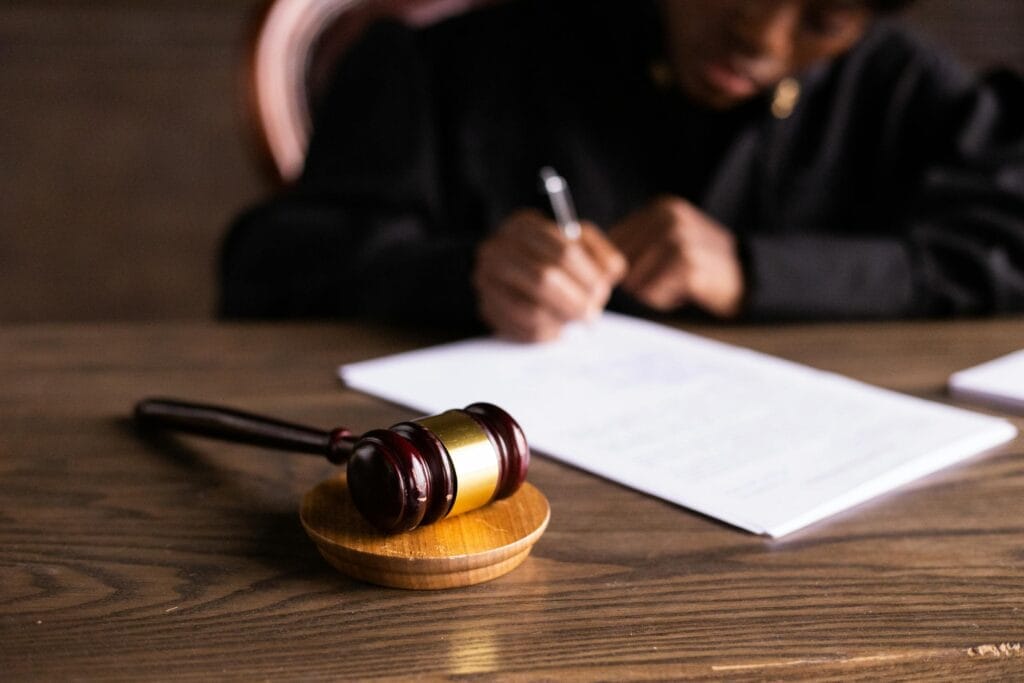 A gavel and legal documents on a desk in a law office