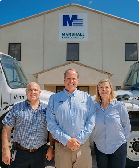 Marshall Shredding leadership team in front of their NAID AAA certified mobile shredding trucks