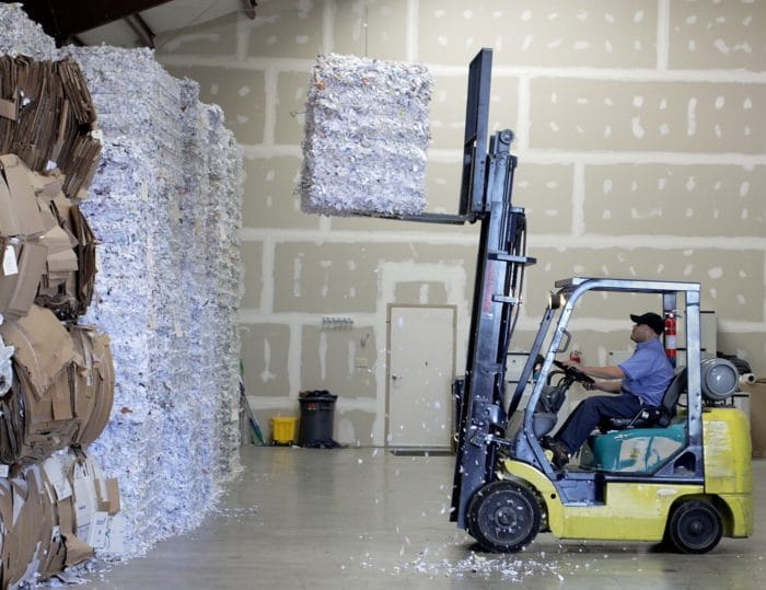 forklift moving HIPAA compliant shredded paper