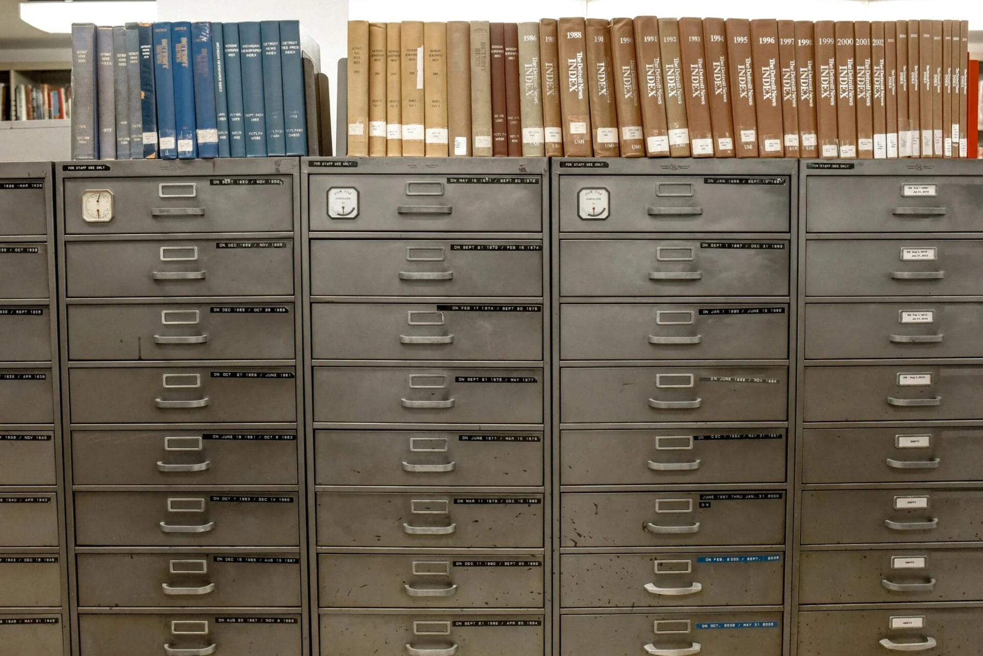 File cabinets with indexed books on top.