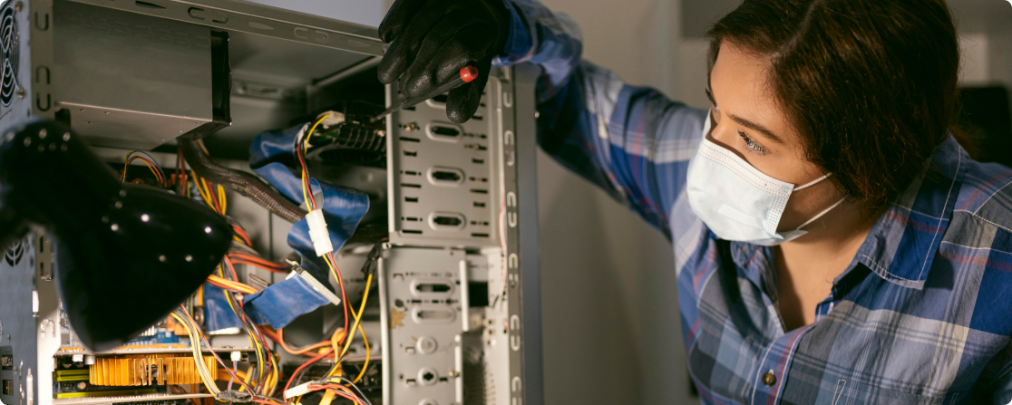 Person working on computer hardware.